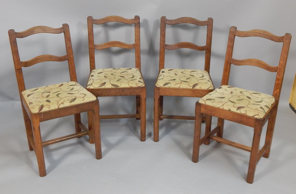 Appraisal: A set of four oak Mouseman style dining chairs by