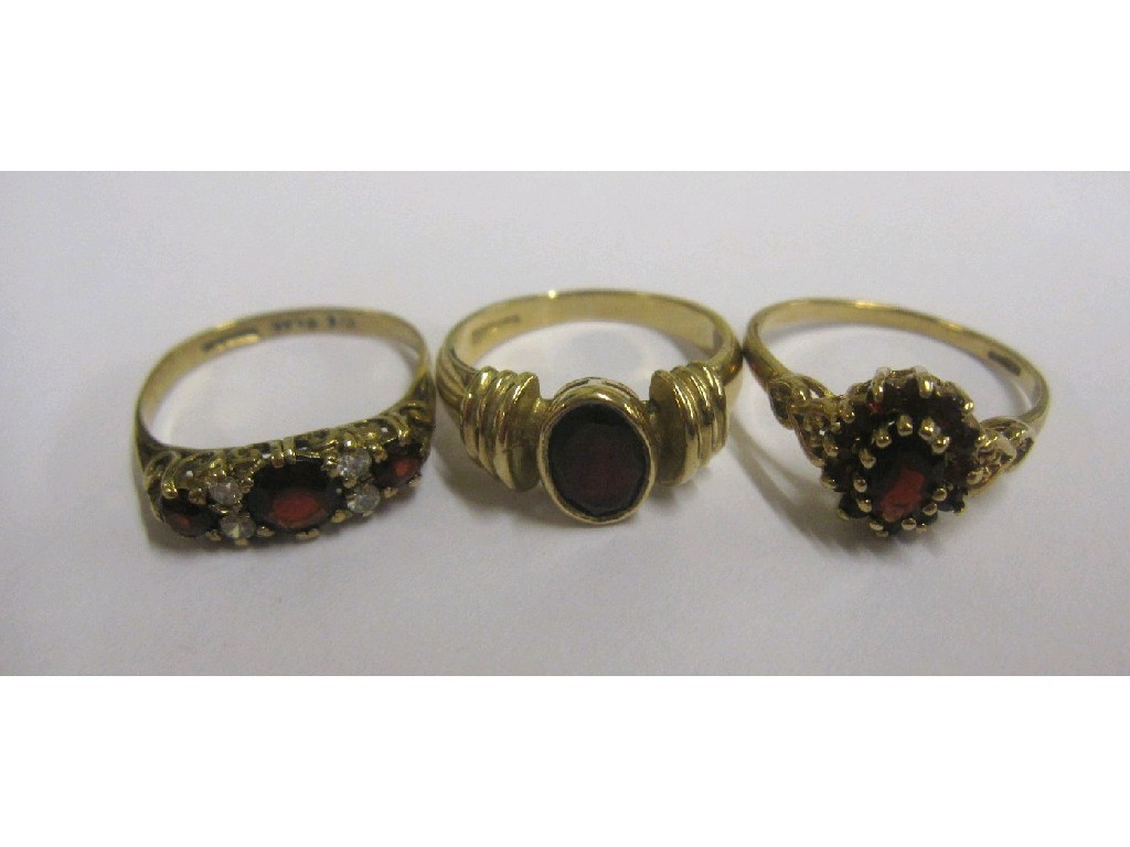 Appraisal: Lot comprising ct gold garnet and cz set ring ct