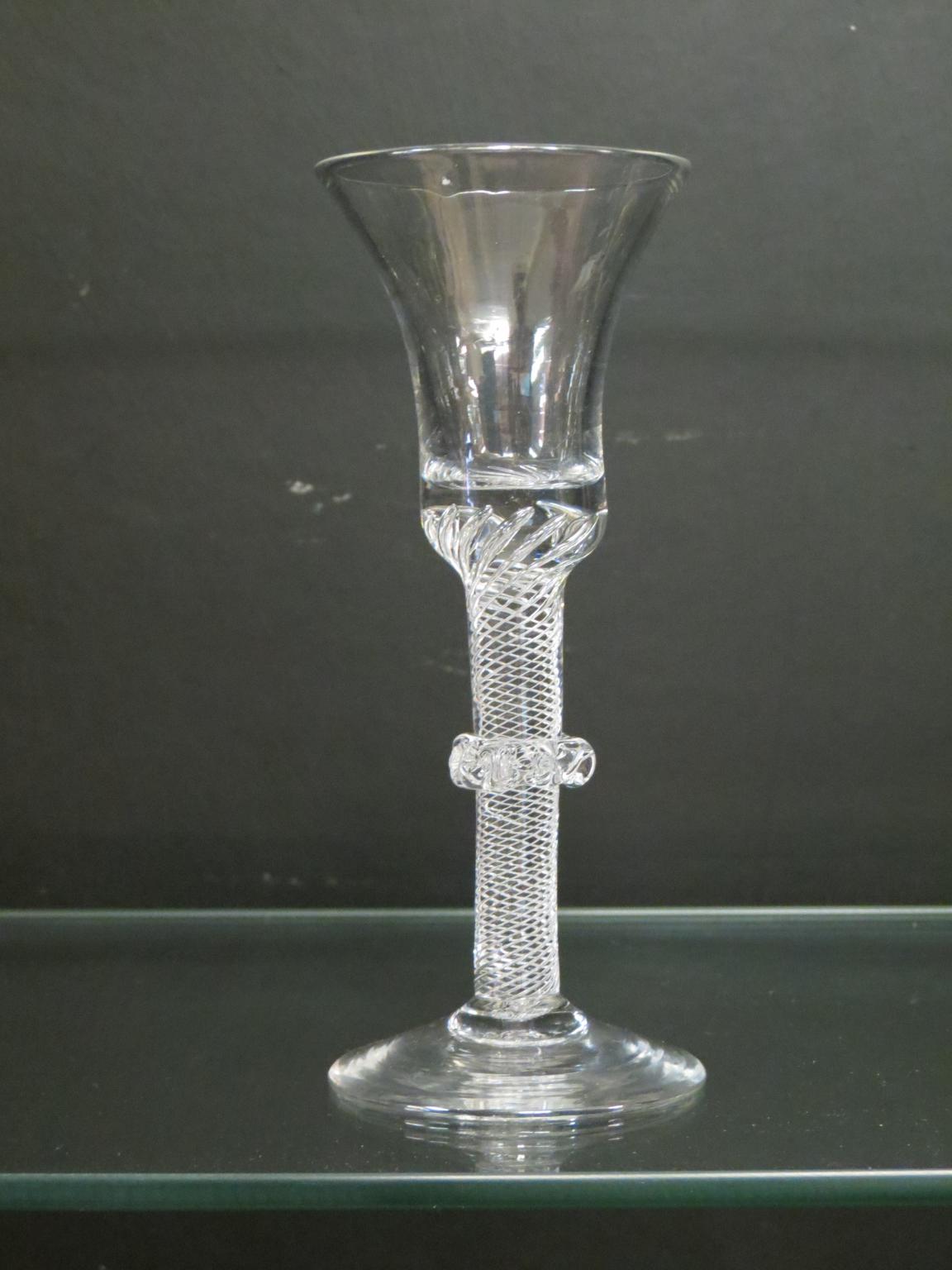 Appraisal: An th century English cordial glass bell-bowl on single-series air-twist