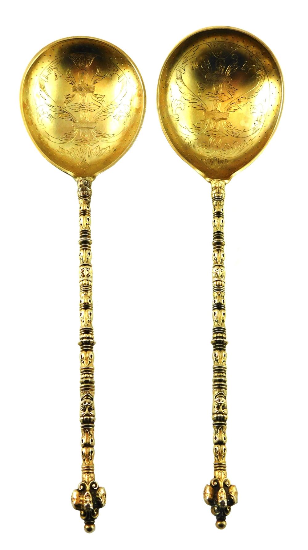 Appraisal: SILVER Pair of finely engraved vermeil serving spoons by Marius