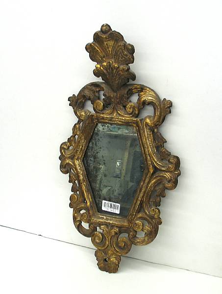 Appraisal: An Italian Rococo style carved giltwood mirror th century The