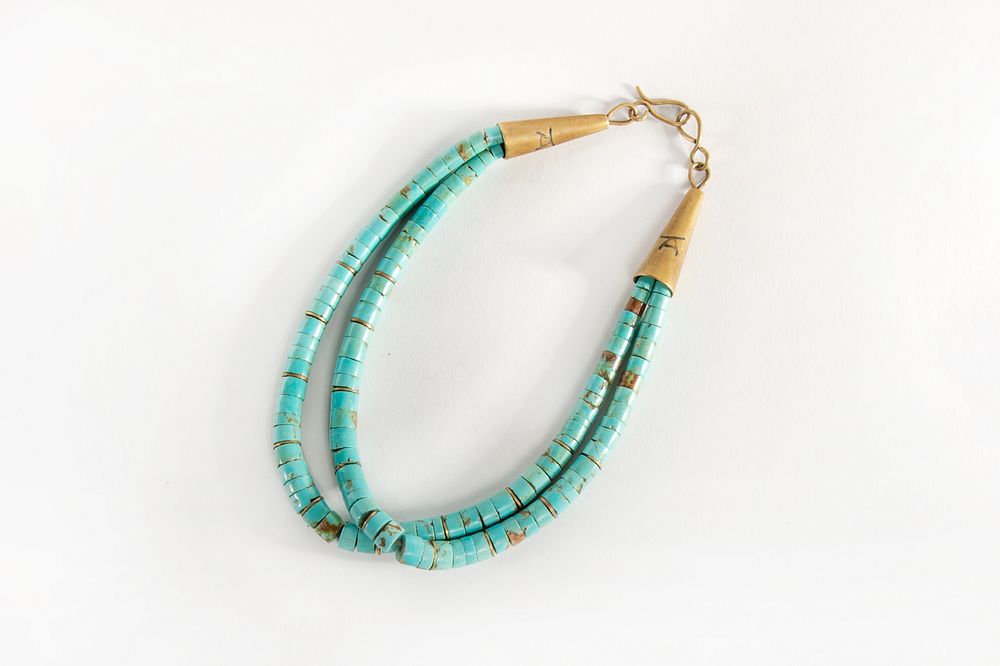 Appraisal: A Tony Aguilar Turquoise and Brass Heishi Necklace ca Santo