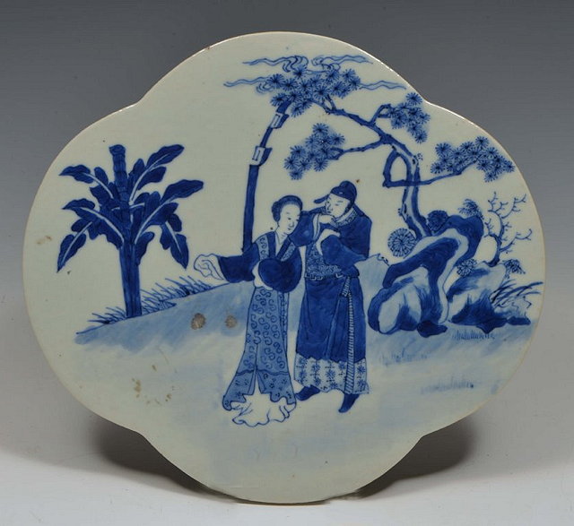 Appraisal: A CHINESE BLUE AND WHITE QUATREFOIL SHAPED TILE figures in