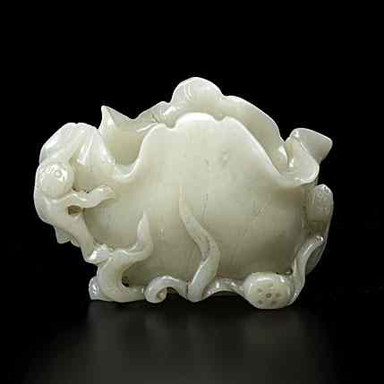 Appraisal: Chinese Jade Water Coupe Chinese th century A pale celadon