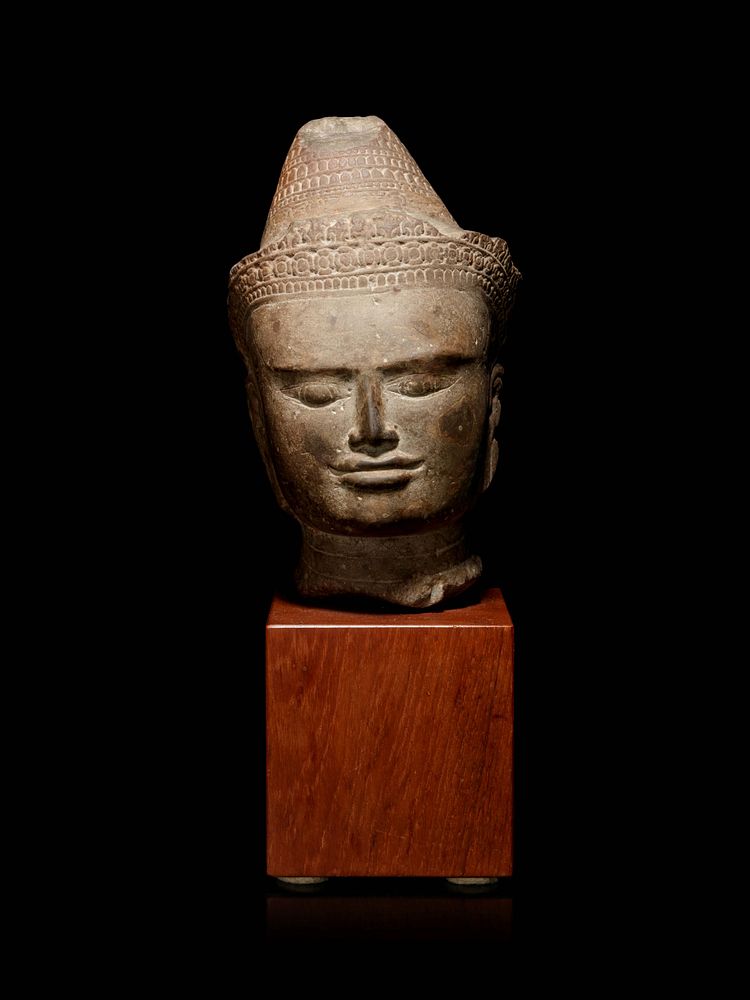 Appraisal: A Khmer Greystone Head of Buddha Height of head in