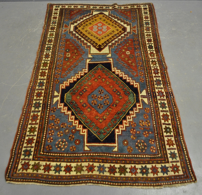 Appraisal: - Very colorful Kazak center hall oriental carpet with overall