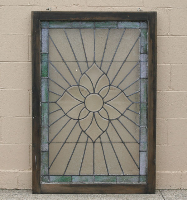 Appraisal: Framed beveled leaded glass window with quatrefoil motif beveled center