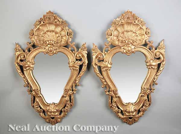 Appraisal: A Pair of Italian Rococo-Style Carved Giltwood Mirrors each shield-shaped