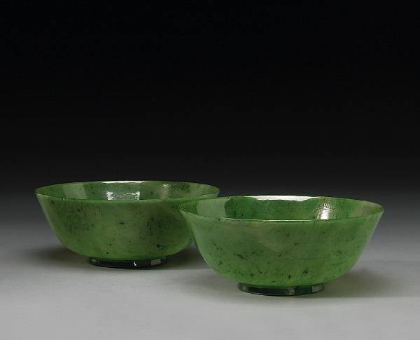 Appraisal: A pair of 'spinach' jade bowls th Century Of simple