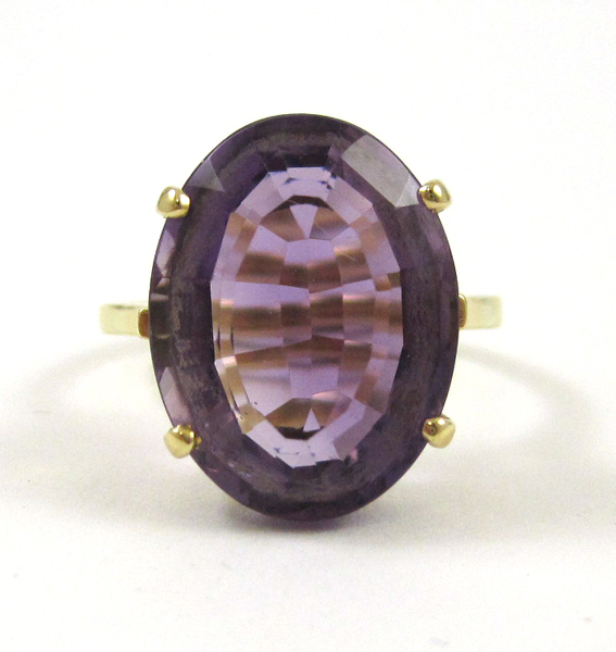 Appraisal: AMETHYST AND EIGHTEEN KARAT GOLD RING set with a single