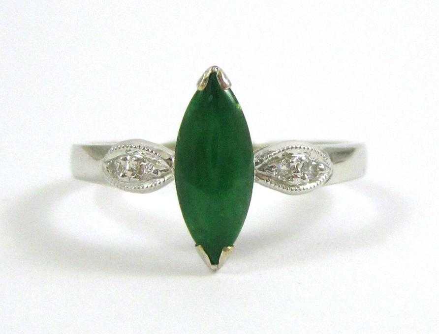 Appraisal: GREEN JADE AND EIGHTEEN KARAT GOLD RING The white gold