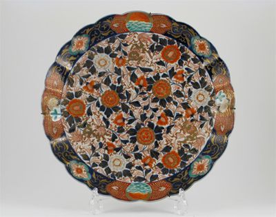 Appraisal: A Japanese Imari charger painted with three lion dogs amidst