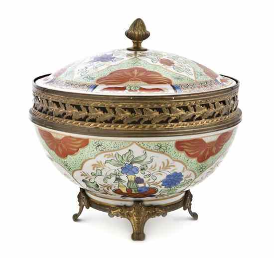 Appraisal: A Continental Gilt Metal Mounted Porcelain Potpourri of circular form