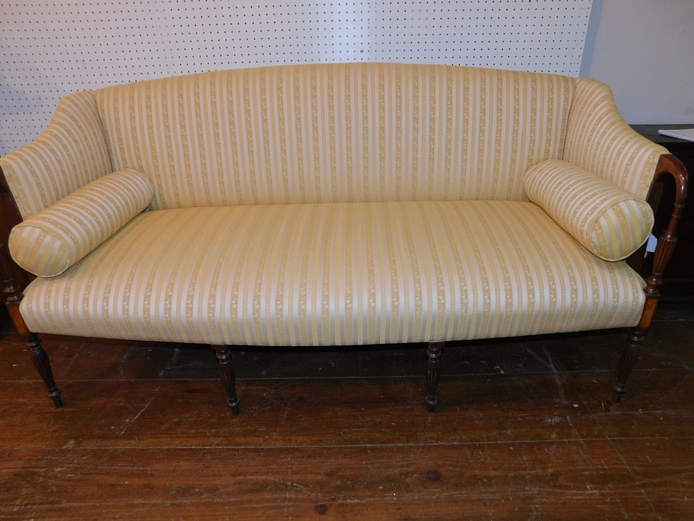 Appraisal: SHERATON STYLE SOFA Custom mahogany Sheraton reeded leg sofa with