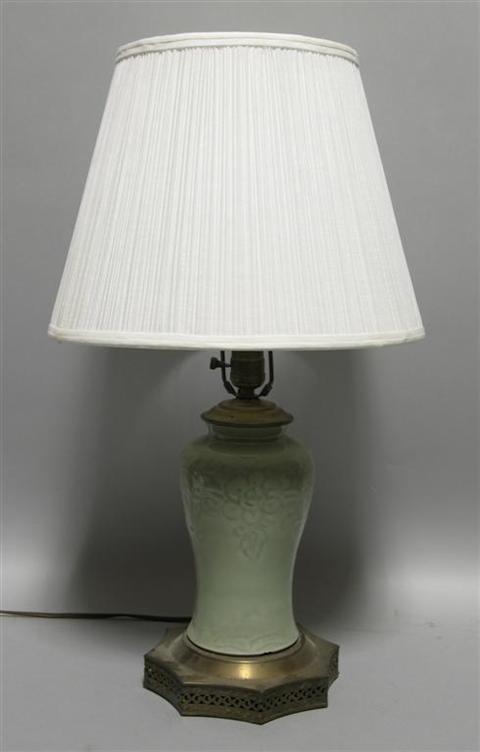 Appraisal: ASIAN CARVED CELADON LAMP The porcelain covered in a rich