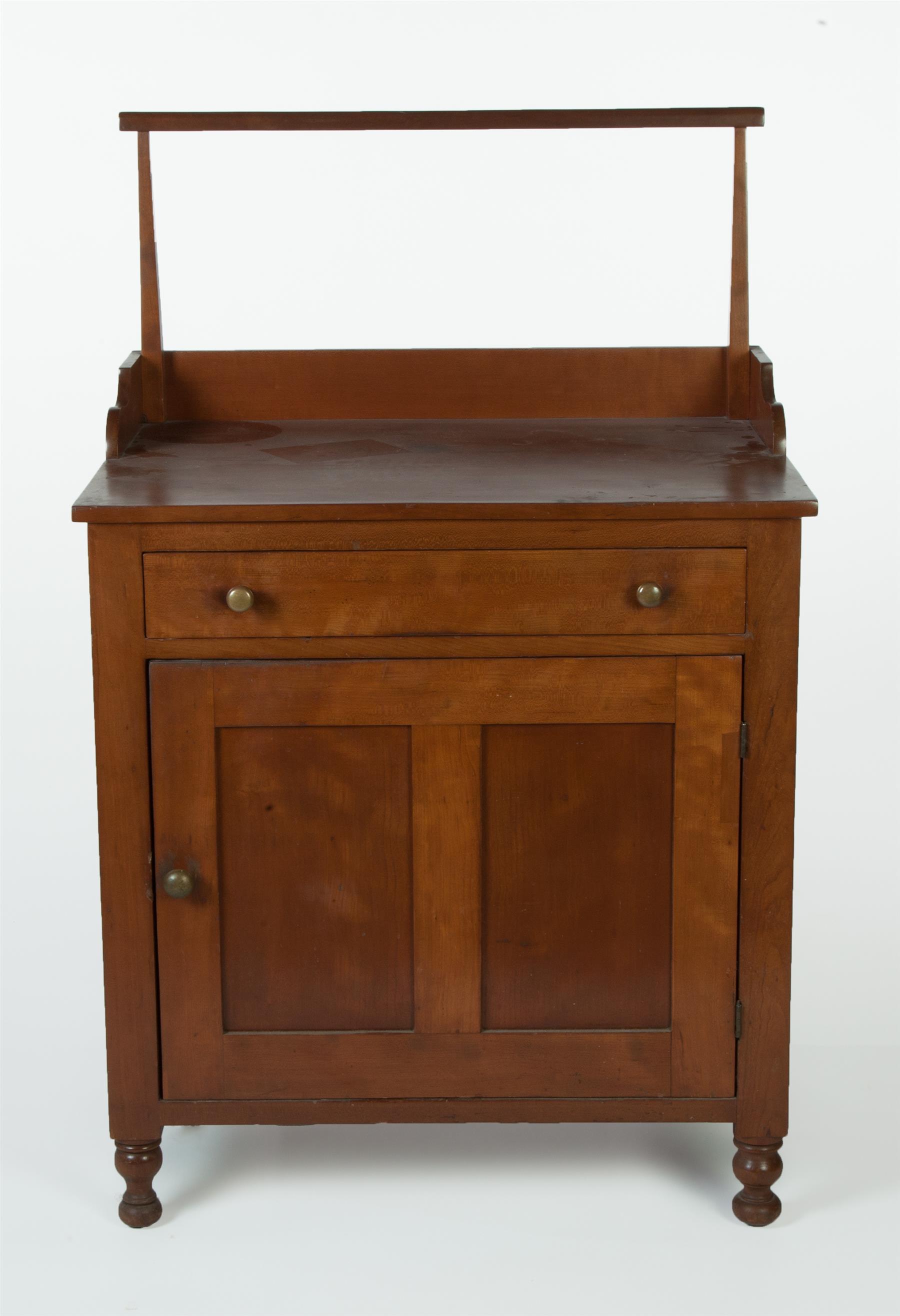 Appraisal: LATE-SHERATON WASHSTAND American mid th century cherry Dovetailed gallery back