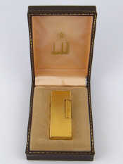 Appraisal: A boxed gold plated Dunhill cigarette lighter