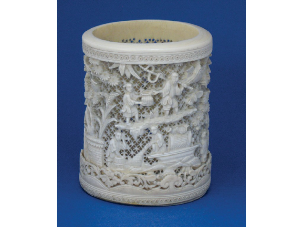 Appraisal: A CHINESE IVORY RETICULATED VASE carved with figures pavilions boats