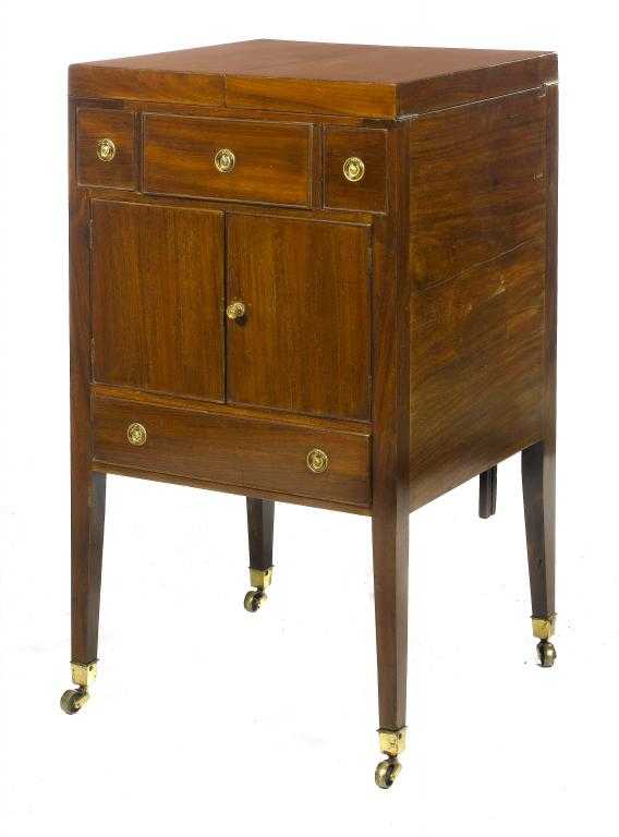 Appraisal: A VICTORIAN MAHOGANY ENCLOSED WASHSTAND the divided top hinged to