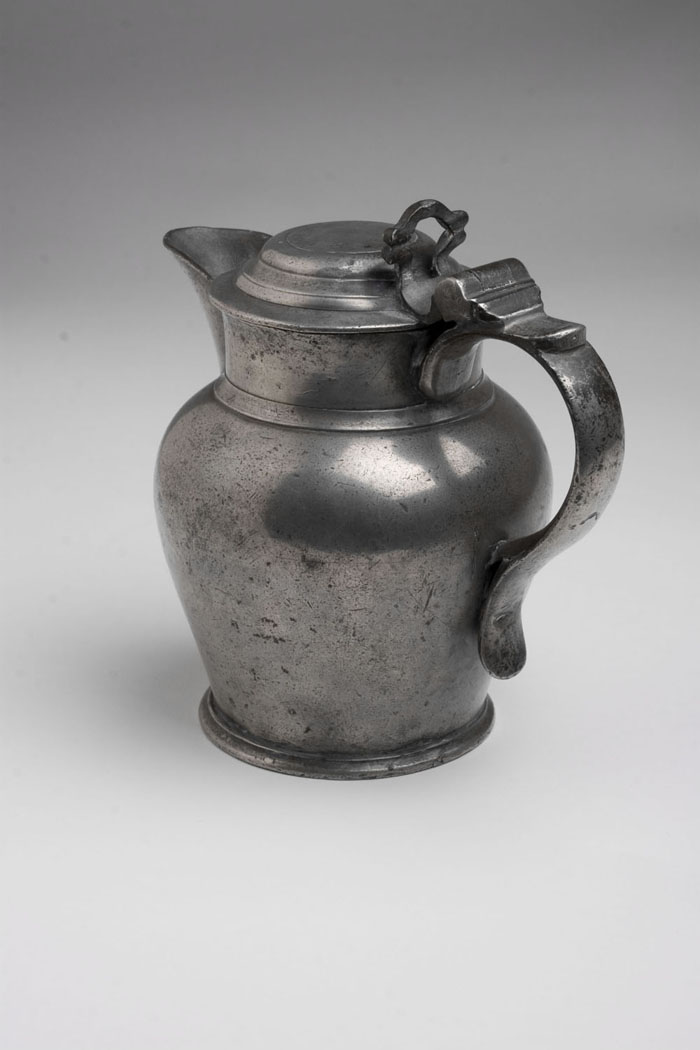 Appraisal: ENGLISH PEWTER LIDDED ALE JUG Having a scroll handle and