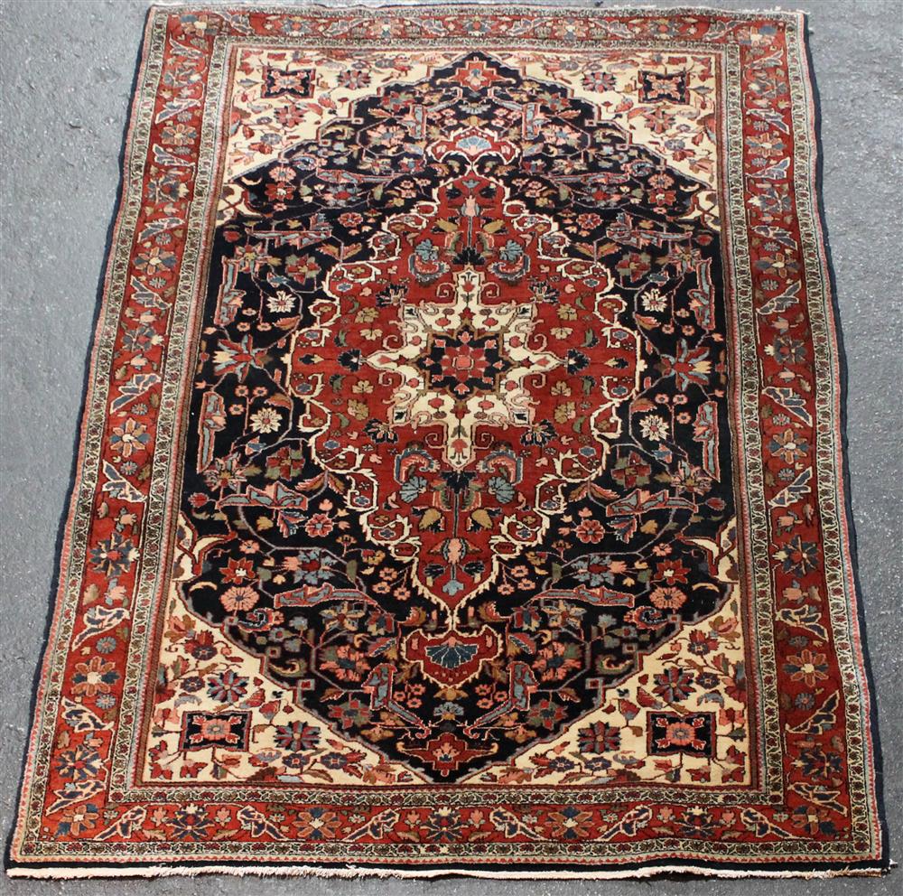 Appraisal: PERSIAN JOZAN SAROUK WOOL RUG with a lobed central medallion