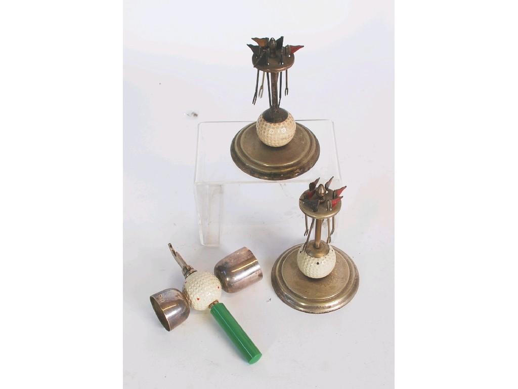 Appraisal: TWO ELECTROPLATE GOLF RELATED COCKTAIL STICK STANDS incorporating a golf