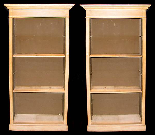 Appraisal: A group of three Neoclassical style pine open bookcases height