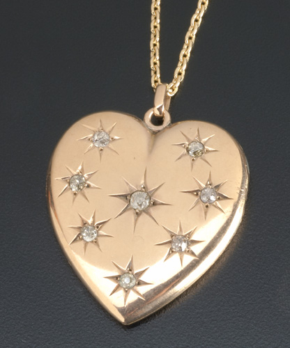 Appraisal: Large diamond heart locket ca k on later k yg