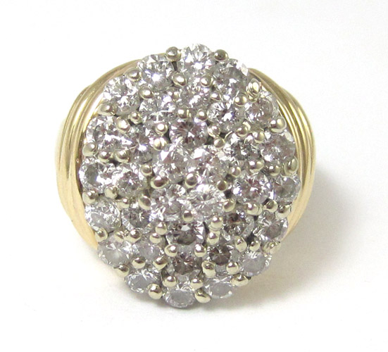 Appraisal: DIAMOND AND FOURTEEN KARAT GOLD CLUSTER RING set with round-cut