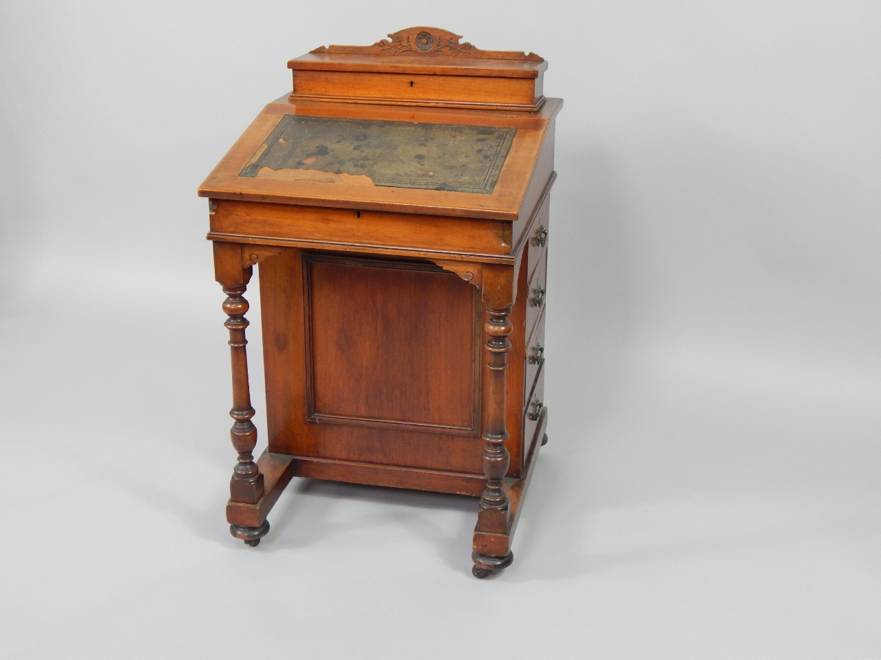 Appraisal: A Victorian mahogany davenport with the upper box section over