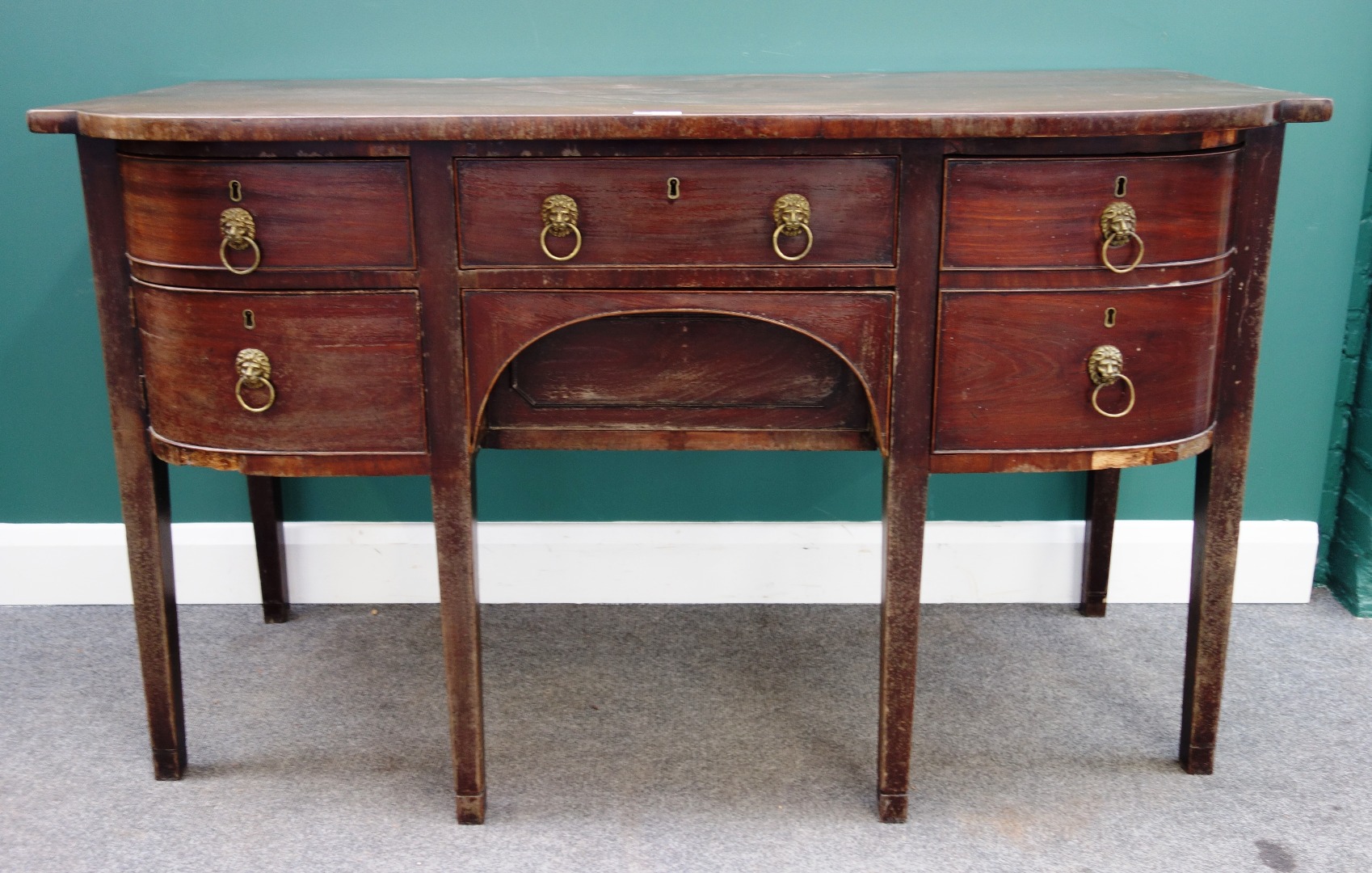 Appraisal: A Regency mahogany bowfront sideboard with five frieze drawers on