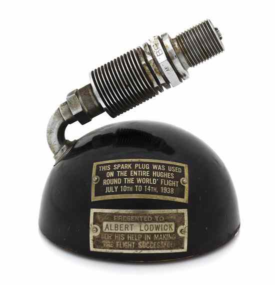 Appraisal: AVIATION HUGHES HOWARD LODWICK AL A sparkplug from Hughes' Around-the-World