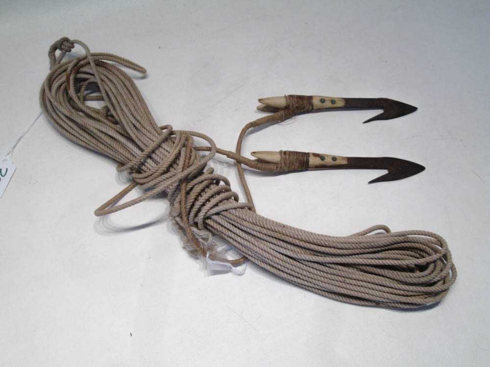 Appraisal: TWO MAKAH BONE AND METAL HARPOONS with cordage Harpoon lengths