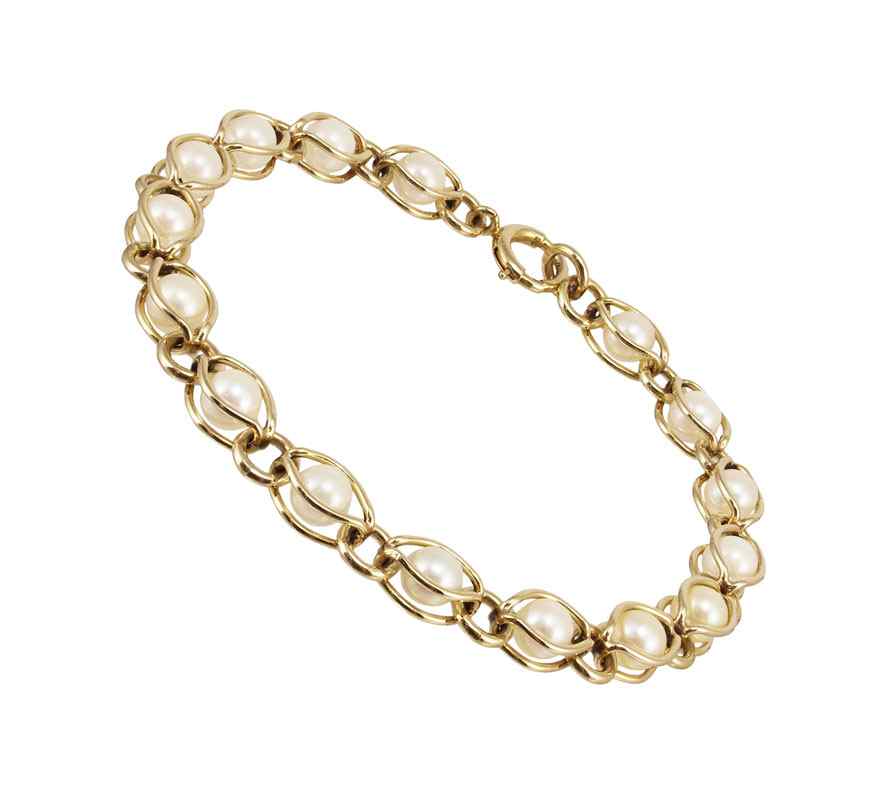 Appraisal: GOLD AND PEARL BRACELET K yellow gold encasing cultured pearls