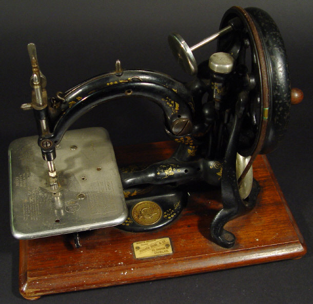 Appraisal: Willcox and Gibbs American patent sewing machine with gilt decoration