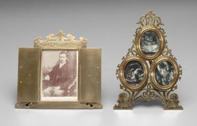 Appraisal: Two ornate brass easel style frames one with three oval