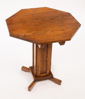 Appraisal: An Arts Crafts style octagonal oak occasional table on square