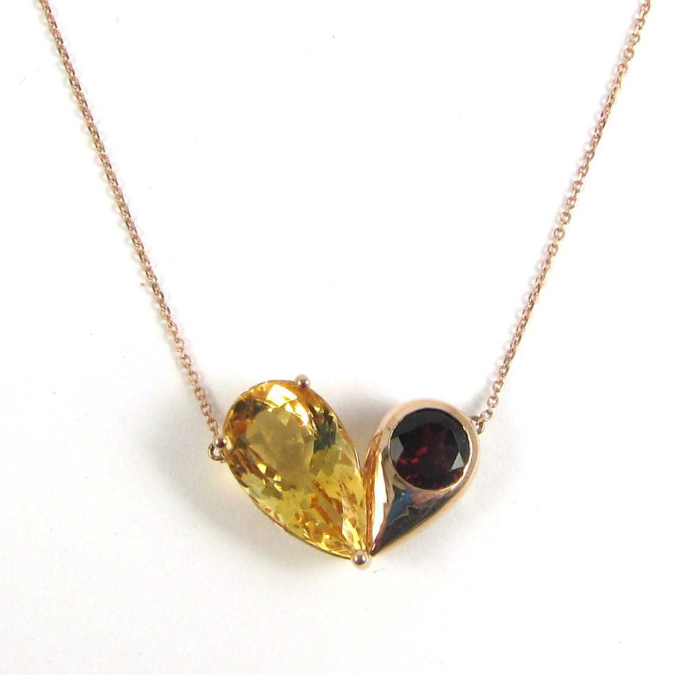 Appraisal: GARNET AND CITRINE PENDANT NECKLACE Pear-cut citrine cts Round-cut red