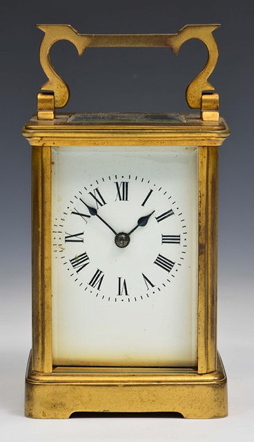 Appraisal: A FRENCH GILT BRASS CARRIAGE CLOCK the white enamel Roman