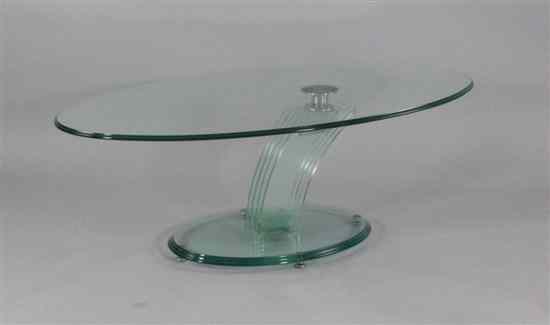 Appraisal: A 's glass oval coffee table in the manner of