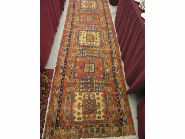 Appraisal: Heriz Persian Handmade Runner square medallions geometrics earthtones unusual '