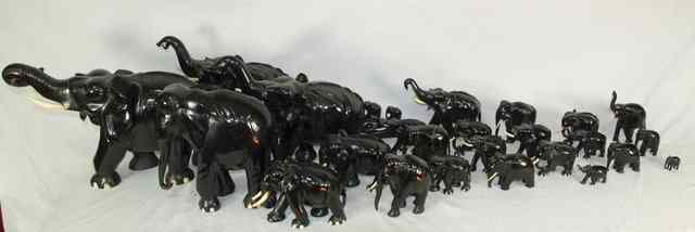 Appraisal: A quantity of ebony and ivory elephants various sizes