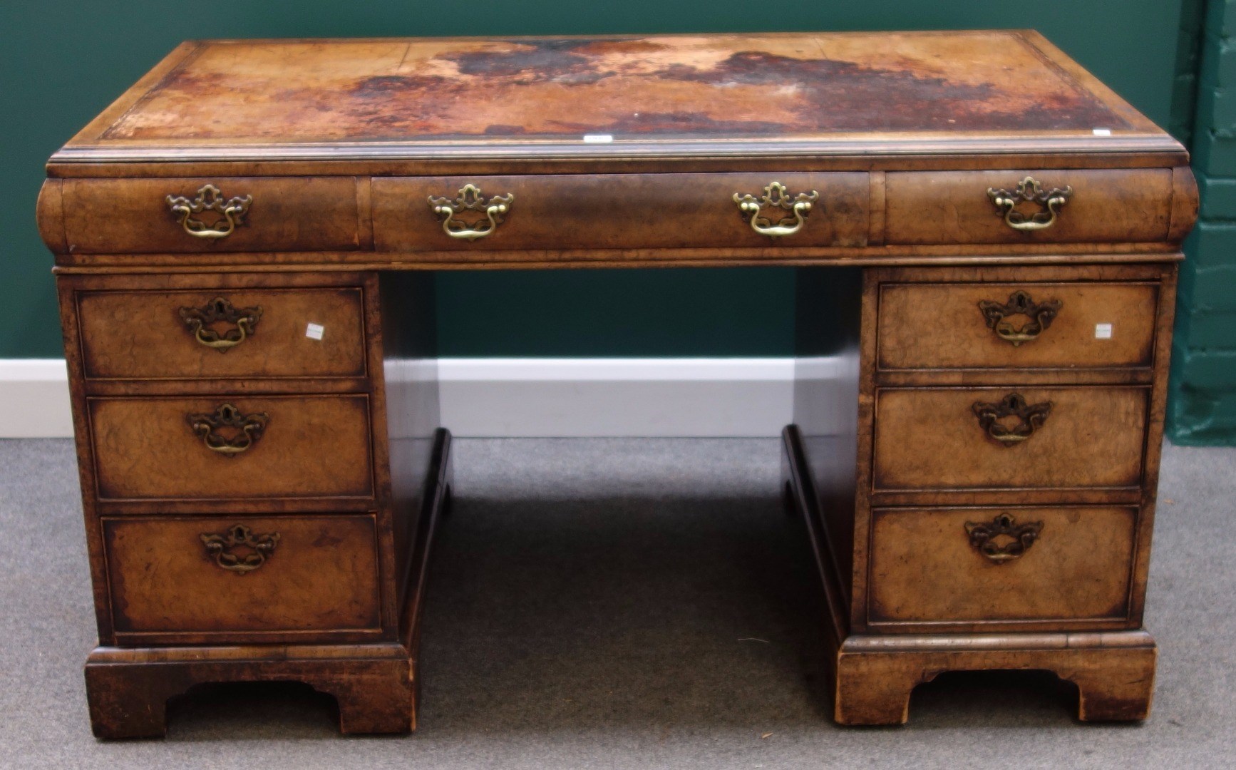 Appraisal: An th century style walnut pedestal desk with nine drawers