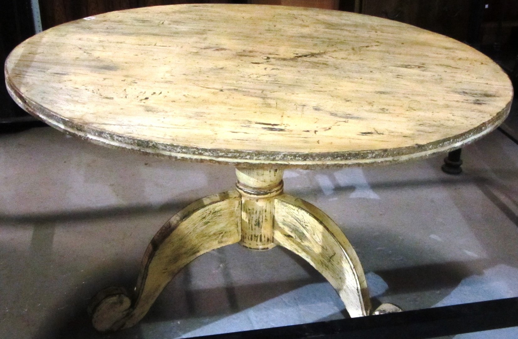 Appraisal: A painted circular table with a tripod base