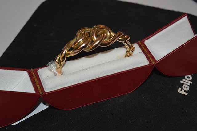 Appraisal: ct gold banglewith stylised decoration in original presentation box