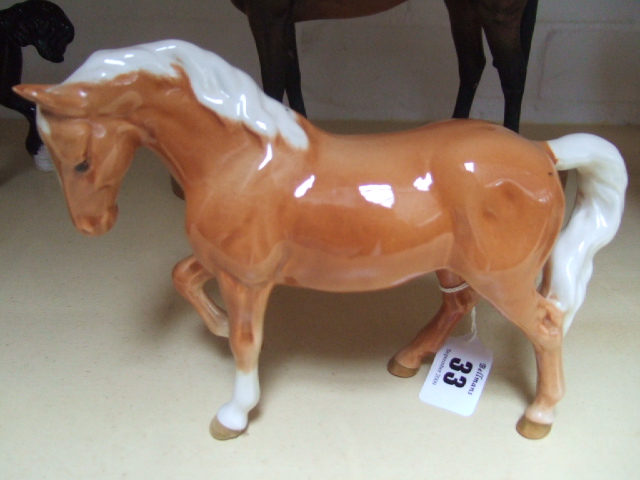 Appraisal: A Beswick horse modeled as a stocky jogging mare palomino