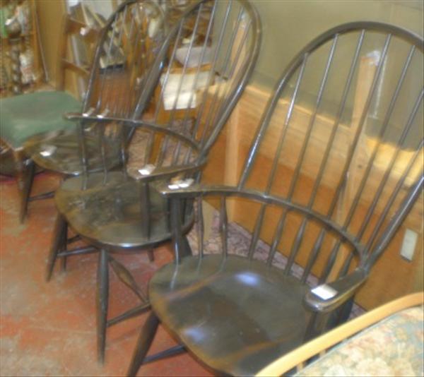 Appraisal: Three matching ebonised spindle back chairs of modern design together