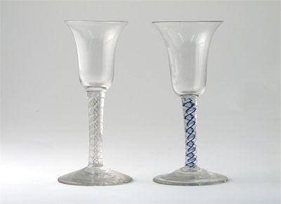 Appraisal: Two coloured twist wine glasses with bell-shaped bowls raised on