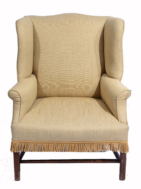 Appraisal: A GEORGE III MAHOGANY WING ARMCHAIR of large proportions on