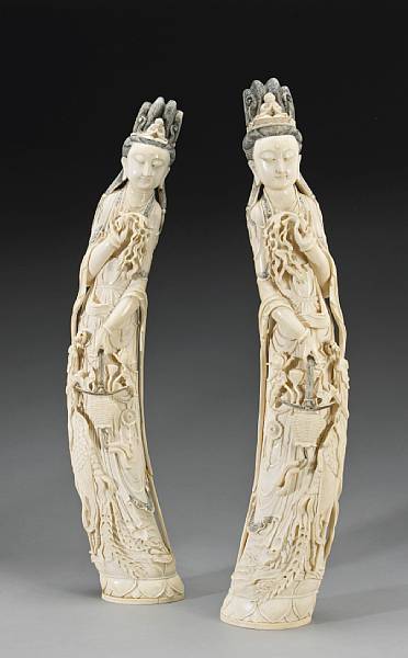 Appraisal: A pair of carved ivory figures of Guanyin Designed as